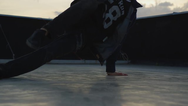 B-boy performing on concrete