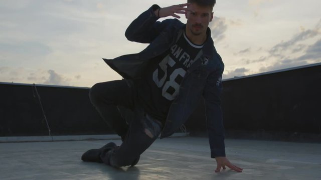 A b-boy performing outside