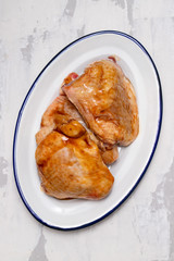 chicken with marinate on dish