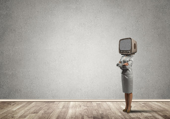 Business woman with an old TV instead of head.