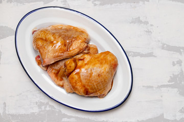 chicken with marinate on dish