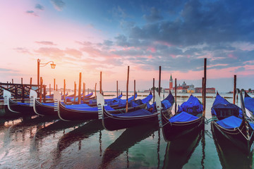 Fototapeta premium Gondolas and San Giorgio Maggiore church from San Marco square at sunrise, Venice, Italy