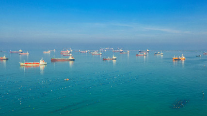 Oil tanker, gas tanker in the high sea.Refinery Industry cargo ship,aerial view,Thailand, in import export, LPG,oil refinery, Logistics and transportation with working crane bridge in harbor