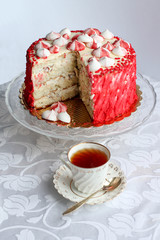 Red homemade cake decorated by hearts.