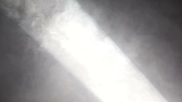 Smoke in soffit spotlights beam on the open air disco party