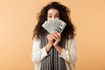 Cheerful young woman wearing winter scarf © Drobot Dean