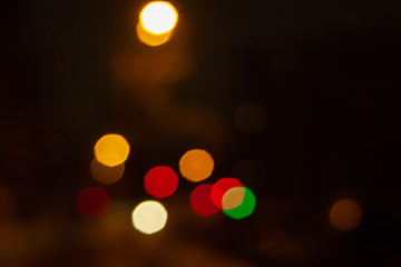 Fototapeta premium Blurred night background of city street road with bokeh effect. Abstract wallpaper for design and editing images.