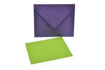purple envelope and green card isolated on white background