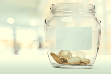Money Jar with  coins on white background