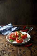 Quinoa stuffed tomatoes with pine nuts and basil