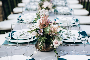 Wedding table setting and decoration. Flowers.