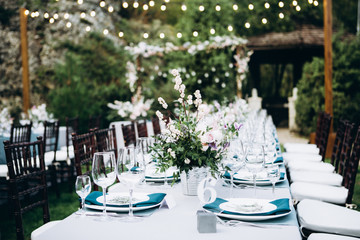 Wedding table setting and decoration. Flowers.
