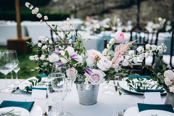 Wedding table decoration in rustic style. Wedding flowers.