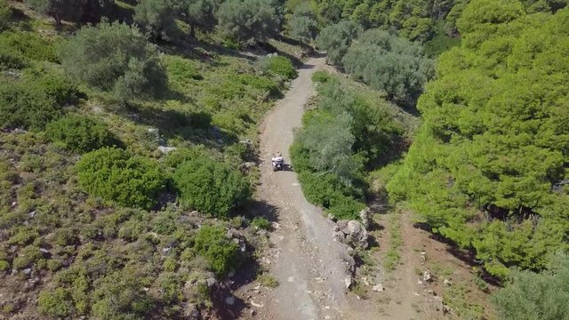 atv on road in mountains by drone