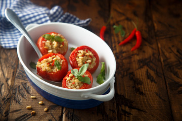 Quinoa stuffed tomatoes with pine nuts and basil