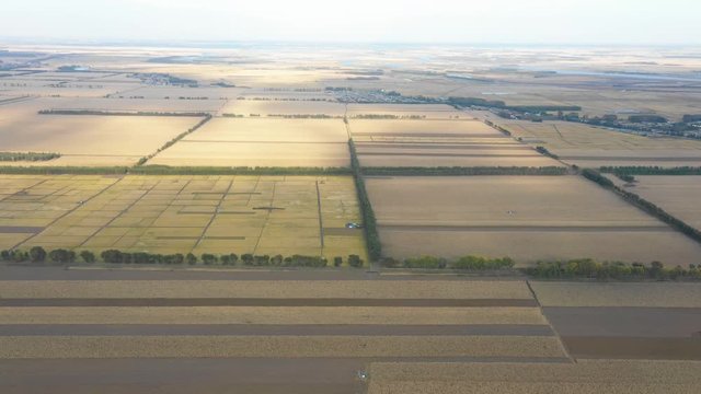 Fly over beautiful cereal cultivated farm land with sunshine on it, Qiqihar, Heilongjiang, China, Asia.