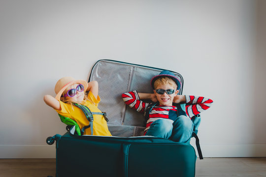 Happy Kids -boy And Girl- Enjoy Packing And Travel