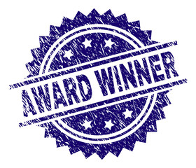 AWARD WINNER stamp seal watermark with distress style. Blue vector rubber print of AWARD WINNER text with scratched texture.