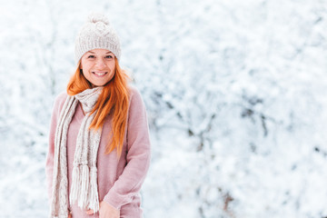 Portrait of a young woman in a snowy winter day