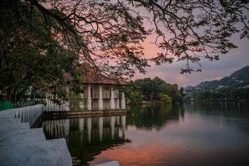 old wooden bridge over the river at sunset