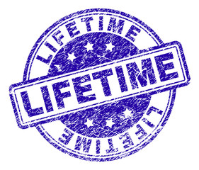 LIFETIME stamp seal watermark with grunge texture. Designed with rounded rectangles and circles. Blue vector rubber print of LIFETIME label with grunge texture.