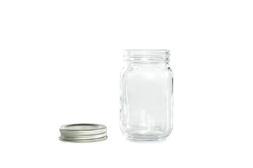 Empty jar of silver cap is open on a white background.