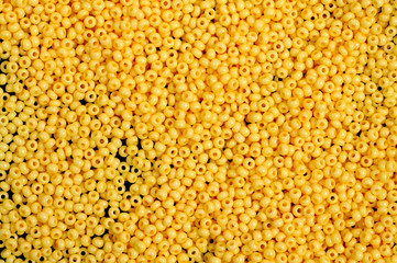 Flame-orange glass beads background - closeup beads texture