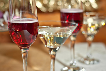 Glass glasses with colored drinks on the table. alcoholic drinks at the buffet