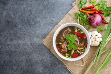 Delicious spicy salad pickled mussels with tamarind source on vintage table. Thai popular food