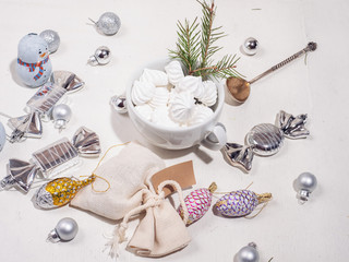 Set of multicolored wrappers, marshmallow, bisa cookies, Christmas decorations and other Christmas attributes