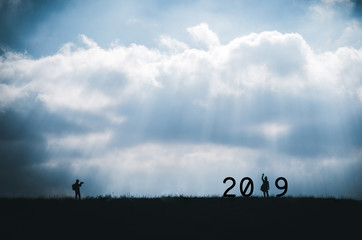 Concept new year 2019.Silhouette Handsome young man taking a lover into the new year 2019. Minimalist style.