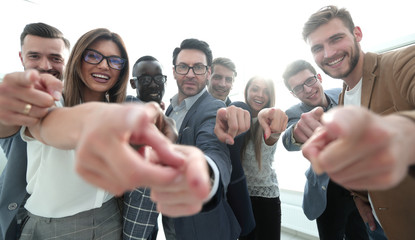 group of successful business people pointing at you