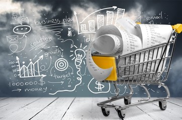 Supermarket check with numbers in shopping cart, close-up view