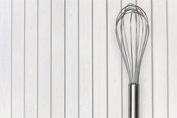 Stainless steel whisk isolated