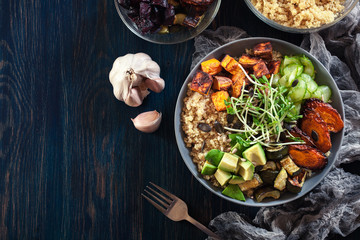 Colorful buddha bowl with quinoa and roasted and fresh vegetables
