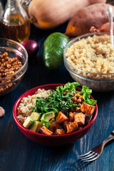 Colorful buddha bowl with quinoa and roasted and fresh vegetables