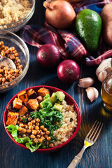 Colorful buddha bowl with quinoa and roasted and fresh vegetables