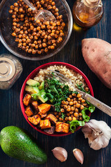 Colorful buddha bowl with quinoa and roasted and fresh vegetables