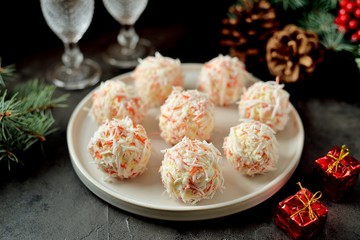 Cheese balls in crab shavings is a traditional Russian snack for Christmas and New Year's party. © chudo2307
