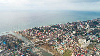 Fototapeta premium Lasarevskoye, Sochi. Winter. Aerial view of a coastal town in mountains