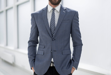 close up.handsome businessman standing in the office
