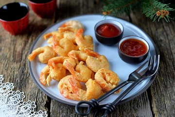 Crispy fried shrimp tails with sauces.