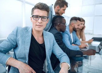 designers are discussing a new project using a laptop