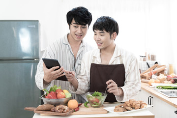 Sweet gay couple preparing food