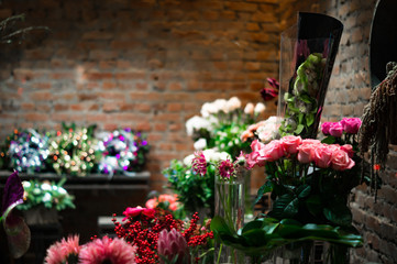 Fototapeta na wymiar stylish flower shop with brick walls