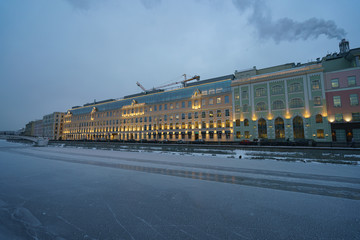 Fototapeta na wymiar Image of Sadovnicheskaya embankment at winter evening in Moscow. 