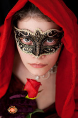 Mysterious Woman with a Mask, holding a rose
