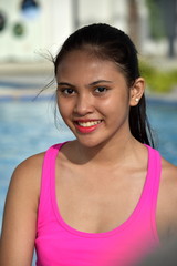 Cute Diverse Girl Teenager Smiling Sitting By Pool