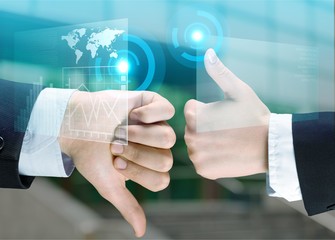 Human hands showing agree sign Versus disagree on background
