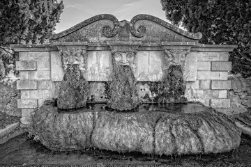 Fontaine de Lourmarin. The fountain with three masks in Lourmarin, Provence, Luberon, Vaucluse, France